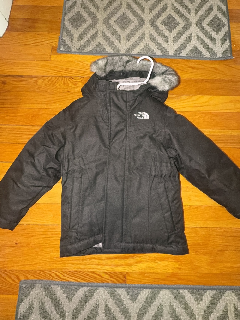 The North Face Kids Black Hooded Puffer Jacket with Faux Fur Trim